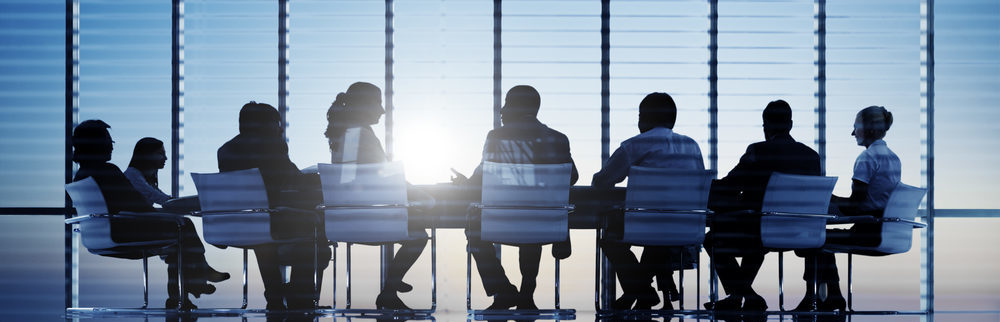 Office workers attending a meeting in an office room